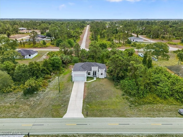 409 Columbus Blvd S, Lehigh Acres, FL 33974 - drone / aerial view of a heavily wooded area