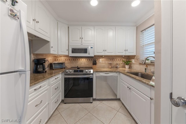 325 Charlemagne Blvd Unit A104, Naples, FL 34112 - kitchen with stainless steel appliances, a sink, white cabinetry, crown molding, and tasteful backsplash