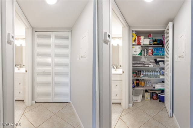 325 Charlemagne Blvd Unit A104, Naples, FL 34112 - hall featuring light tile patterned floors and baseboards