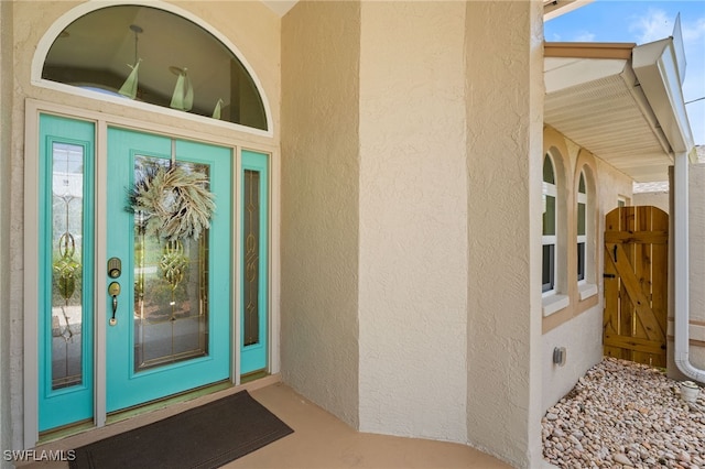 1222 SW 54th St, Cape Coral, FL 33914 - doorway to property with stucco siding