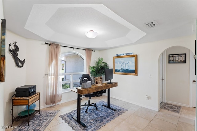1222 SW 54th St, Cape Coral, FL 33914 - home office featuring arched walkways, a raised ceiling, light tile patterned floors, and baseboards