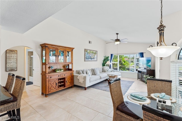 1222 SW 54th St, Cape Coral, FL 33914 - living room featuring vaulted ceiling, ceiling fan, arched walkways, and light tile patterned flooring