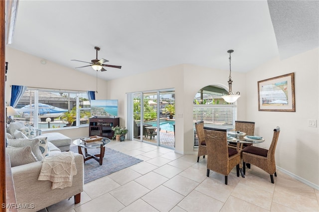 1222 SW 54th St, Cape Coral, FL 33914 - dining space featuring vaulted ceiling, a ceiling fan, light tile patterned floors, and baseboards