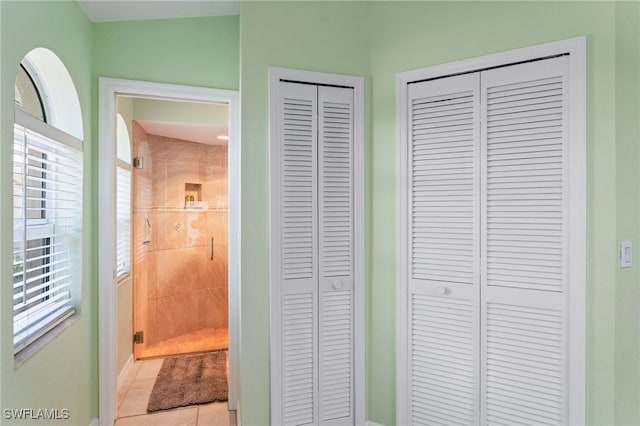 1222 SW 54th St, Cape Coral, FL 33914 - full bathroom with a closet, tile patterned flooring, baseboards, and a stall shower