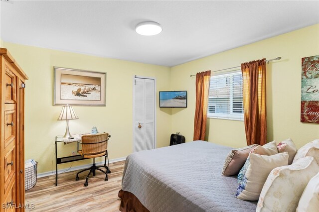 1222 SW 54th St, Cape Coral, FL 33914 - bedroom featuring light wood-style floors, a closet, and baseboards