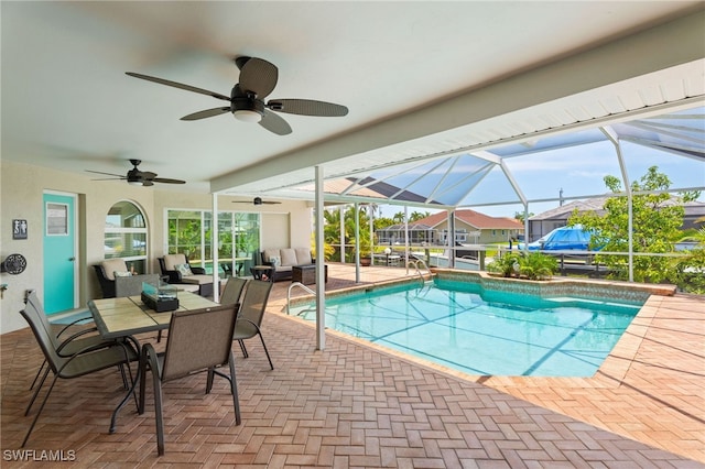 1222 SW 54th St, Cape Coral, FL 33914 - outdoor pool with a ceiling fan, a patio area, glass enclosure, and outdoor dining space