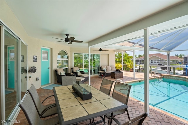 1222 SW 54th St, Cape Coral, FL 33914 - sunroom with a ceiling fan, a pool, an outdoor hangout area, and plenty of natural light