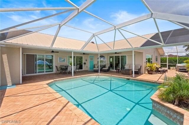 1222 SW 54th St, Cape Coral, FL 33914 - swimming pool featuring ceiling fan, an outdoor living space, a patio area, and glass enclosure
