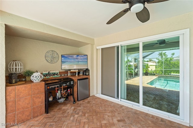 1222 SW 54th St, Cape Coral, FL 33914 - office space featuring a ceiling fan, a textured wall, and a sunroom