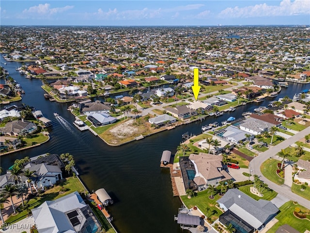 1222 SW 54th St, Cape Coral, FL 33914 - aerial overview of property's location featuring nearby suburban area and a large body of water