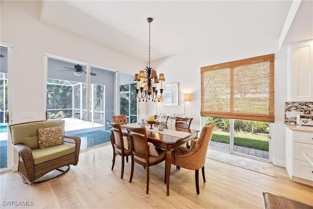 3803 Valentia Way, Naples, FL 34119 - dining space featuring light wood-type flooring, healthy amount of natural light, and a chandelier