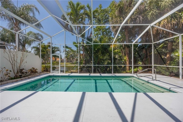 3803 Valentia Way, Naples, FL 34119 - swimming pool featuring a patio and glass enclosure