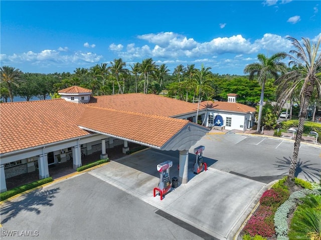 3803 Valentia Way, Naples, FL 34119 - view of property featuring uncovered parking