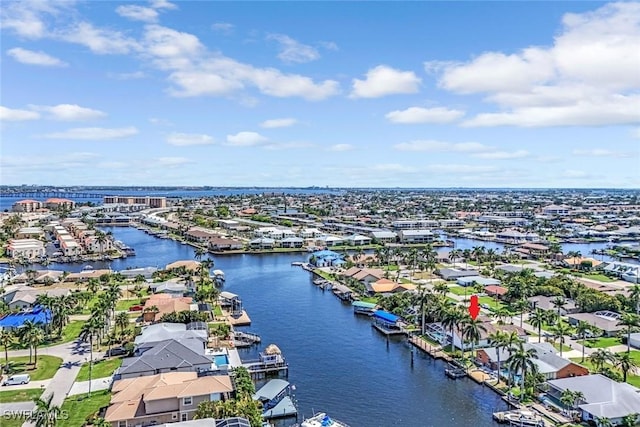 aerial view of residential area with a large body of water