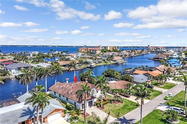 aerial view of residential area featuring a nearby body of water