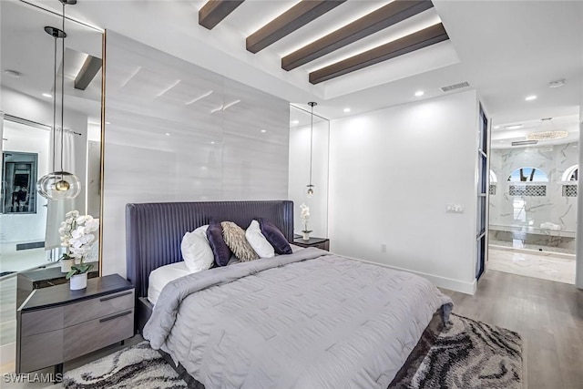 bedroom featuring wood finished floors, recessed lighting, beamed ceiling, and ensuite bathroom