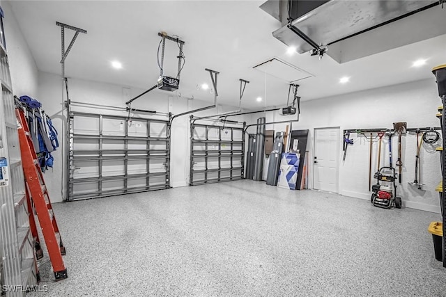 garage featuring a garage door opener, baseboards, and recessed lighting