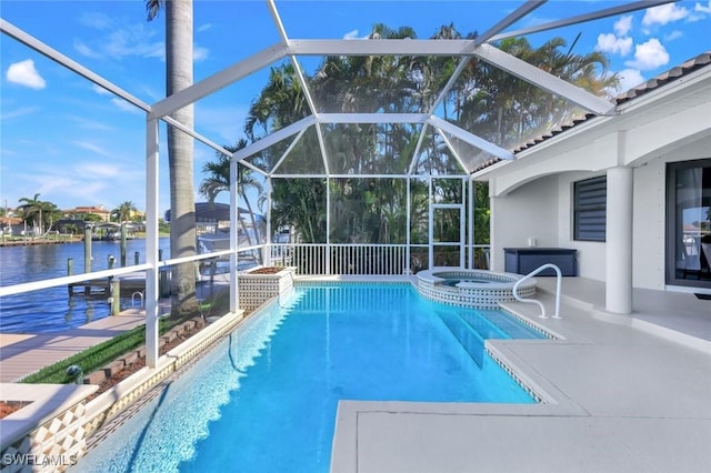 view of pool with a patio area, a pool with connected hot tub, a water view, a boat dock, and glass enclosure