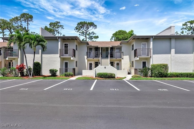7400 College Pkwy Unit 5A, Fort Myers, FL 33907 - view of property featuring uncovered parking