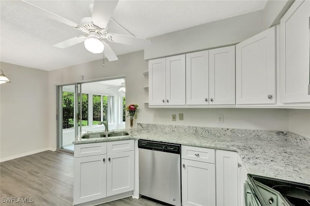 7400 College Pkwy Unit 5A, Fort Myers, FL 33907 - kitchen featuring stainless steel dishwasher, a sink, electric range oven, ceiling fan, and white cabinets