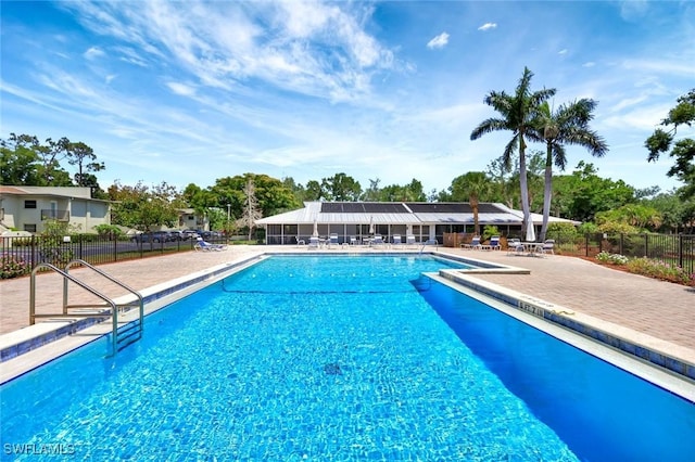 7400 College Pkwy Unit 5A, Fort Myers, FL 33907 - community pool featuring fence and a patio