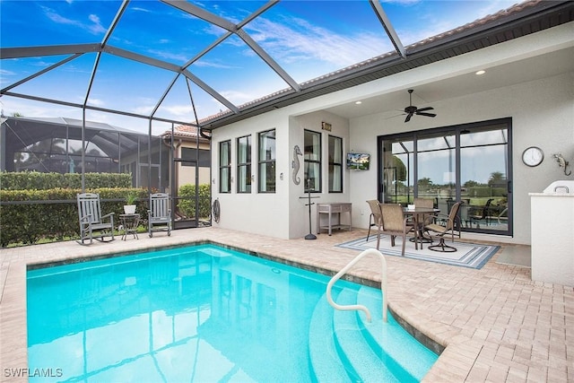 1421 Lucena Ln S, Naples, FL 34113 - outdoor pool with a patio area, a ceiling fan, and glass enclosure