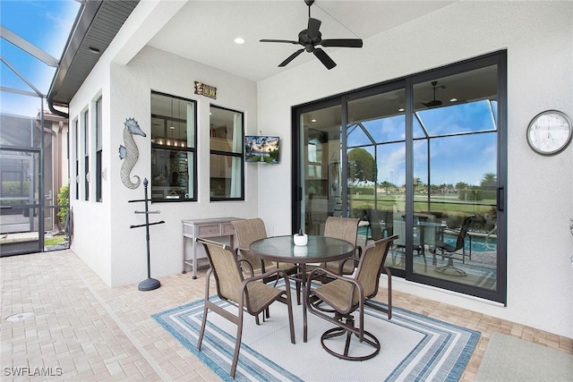 1421 Lucena Ln S, Naples, FL 34113 - view of patio featuring ceiling fan, a lanai, and outdoor dining area