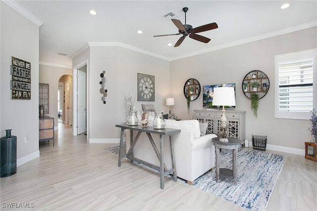1421 Lucena Ln S, Naples, FL 34113 - living area featuring arched walkways, a ceiling fan, recessed lighting, baseboards, and crown molding