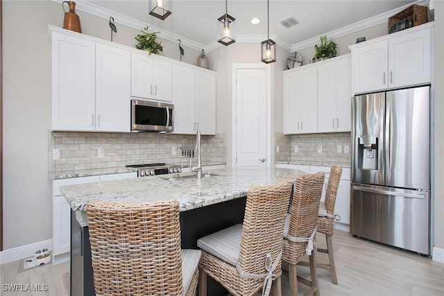 1421 Lucena Ln S, Naples, FL 34113 - kitchen featuring appliances with stainless steel finishes, a sink, white cabinets, recessed lighting, and baseboards