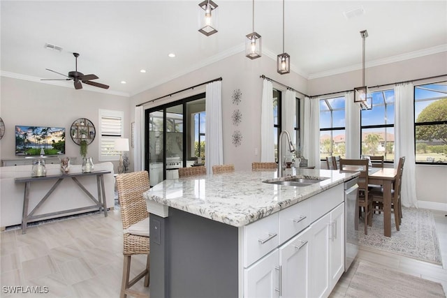 1421 Lucena Ln S, Naples, FL 34113 - kitchen with a sink, crown molding, white cabinets, dishwasher, and a ceiling fan