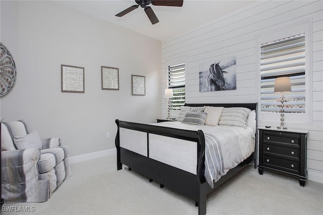 1421 Lucena Ln S, Naples, FL 34113 - bedroom featuring carpet, wood walls, ceiling fan, and baseboards