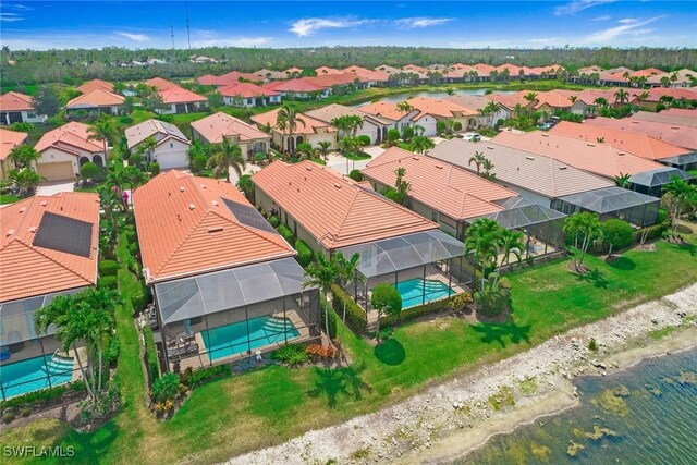 1421 Lucena Ln S, Naples, FL 34113 - aerial view of residential area featuring a pool area and a large body of water