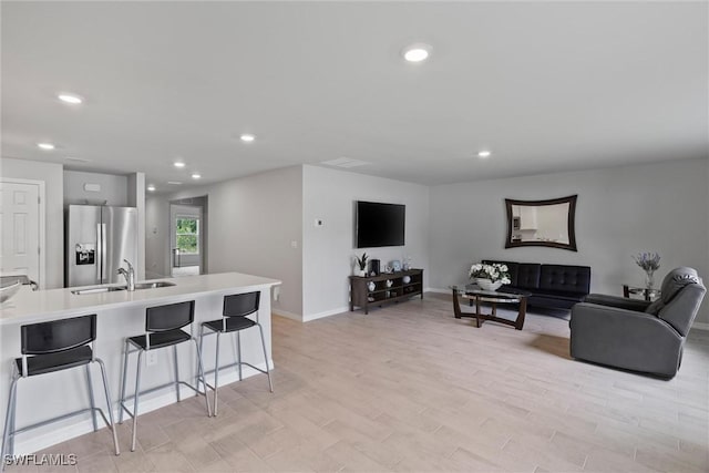 3021 June Cir, Labelle, FL 33935 - living room featuring recessed lighting, light wood finished floors, and baseboards