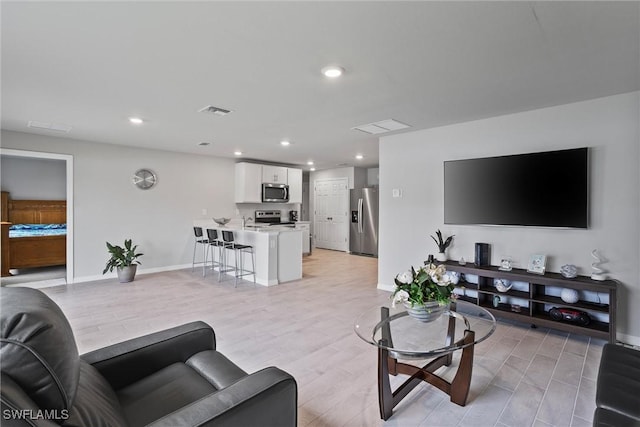 3021 June Cir, Labelle, FL 33935 - living area featuring recessed lighting, baseboards, and light wood finished floors