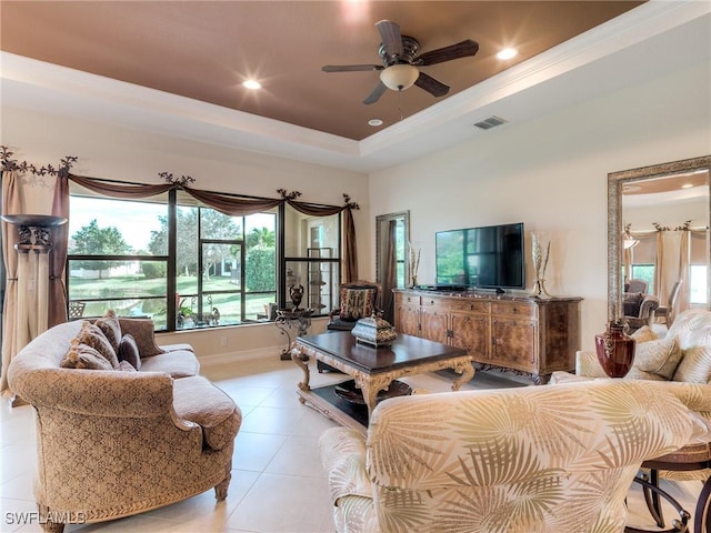 9340 Woodhurst Dr, Naples, FL 34120 - living area featuring light tile patterned floors, a wealth of natural light, a ceiling fan, and visible vents