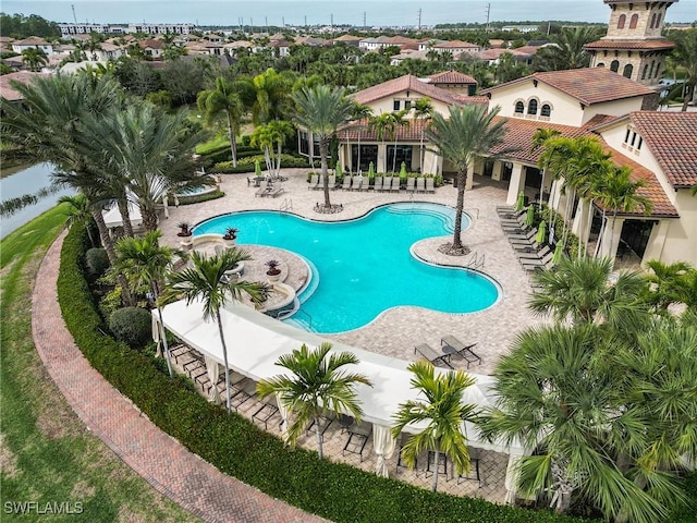 9340 Woodhurst Dr, Naples, FL 34120 - community pool with a patio area