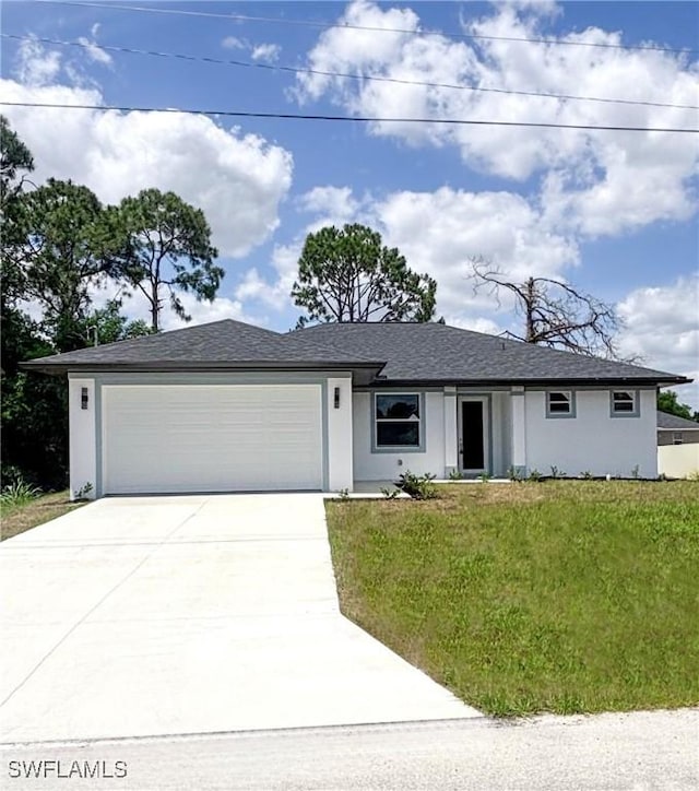 3210 30th St SW, Lehigh Acres, FL 33976 - single story home featuring stucco siding, an attached garage, a front lawn, and driveway