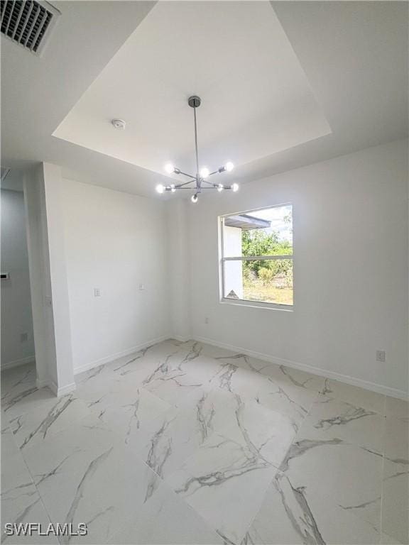 3210 30th St SW, Lehigh Acres, FL 33976 - unfurnished dining area with a chandelier, visible vents, baseboards, and a raised ceiling