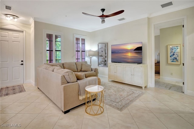 living area featuring ceiling fan, light tile patterned flooring, crown molding, and baseboards