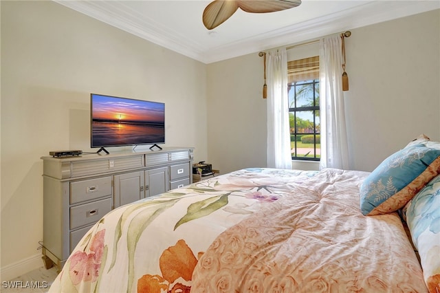 bedroom featuring ornamental molding, baseboards, and a ceiling fan