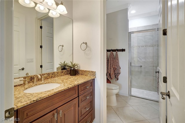 bathroom with toilet, tiled shower, tile patterned floors, and vanity