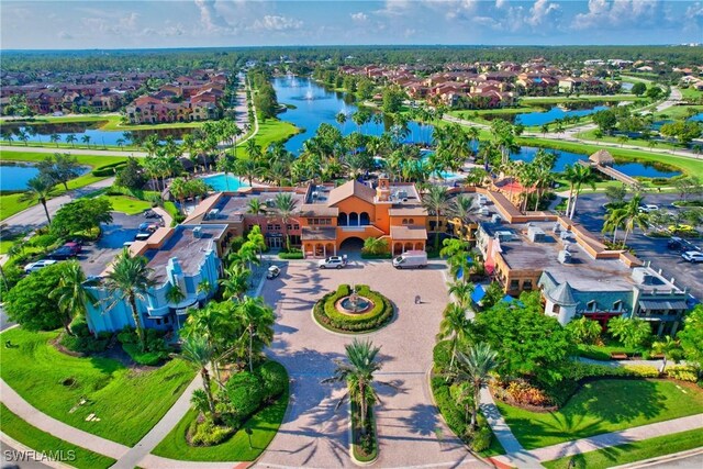 aerial view of residential area featuring a large body of water
