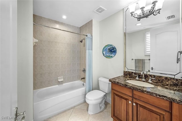 full bath with tile patterned floors, toilet, vanity, washtub / shower combination, and a chandelier