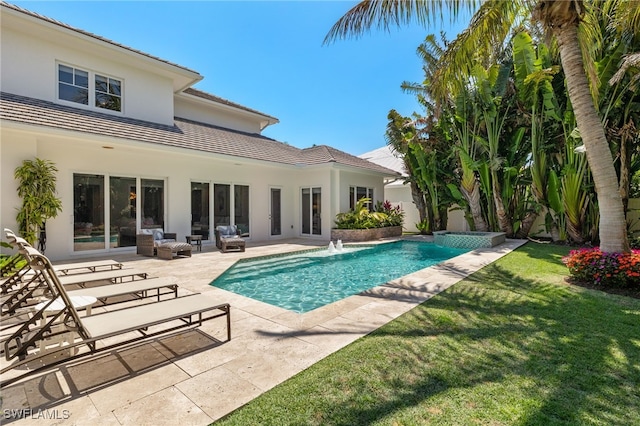 view of pool with a patio, a lawn, an outdoor living space, and a pool with connected hot tub