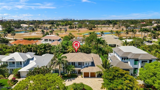 aerial perspective of suburban area with a nearby body of water