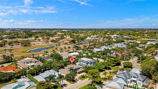 aerial perspective of suburban area with a nearby body of water