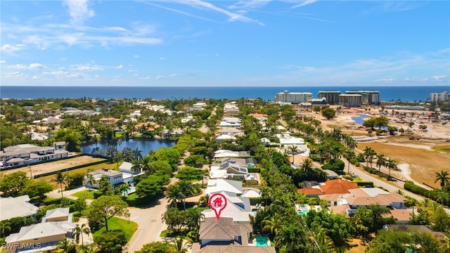 aerial perspective of suburban area with a large body of water
