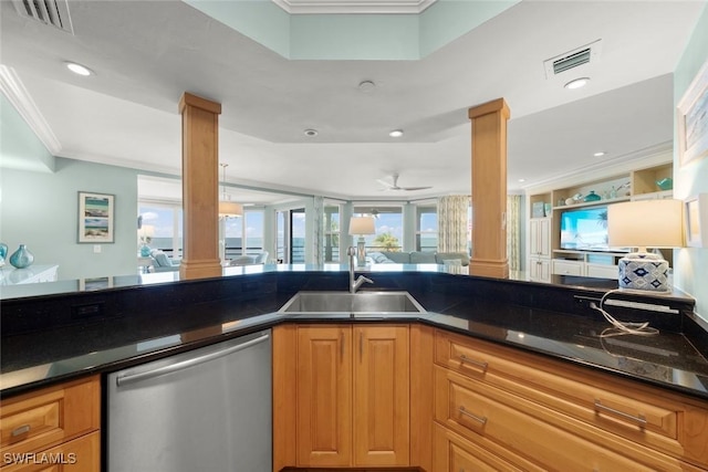 kitchen featuring decorative columns, stainless steel dishwasher, a sink, ornamental molding, and open floor plan