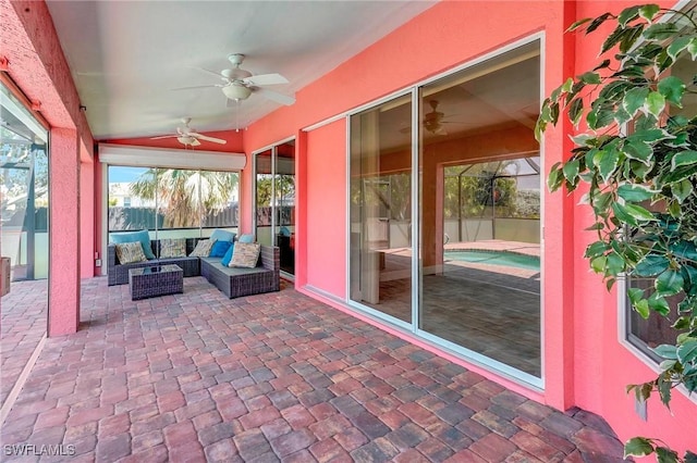 sunroom / solarium featuring an outdoor hangout area, ceiling fan, plenty of natural light, and lofted ceiling