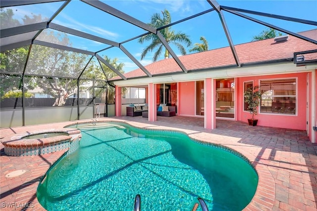 view of swimming pool with a patio, outdoor lounge area, glass enclosure, and a pool with connected hot tub